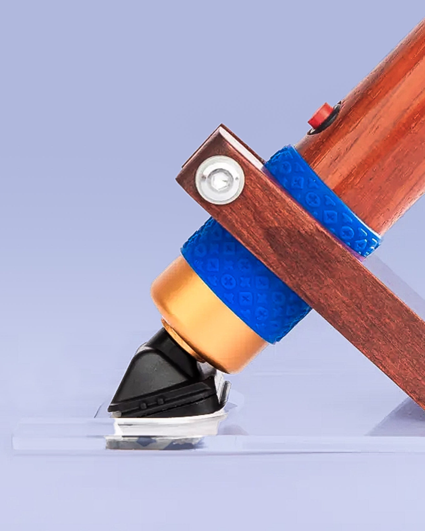 Rosewood rug carver on purple backdrop