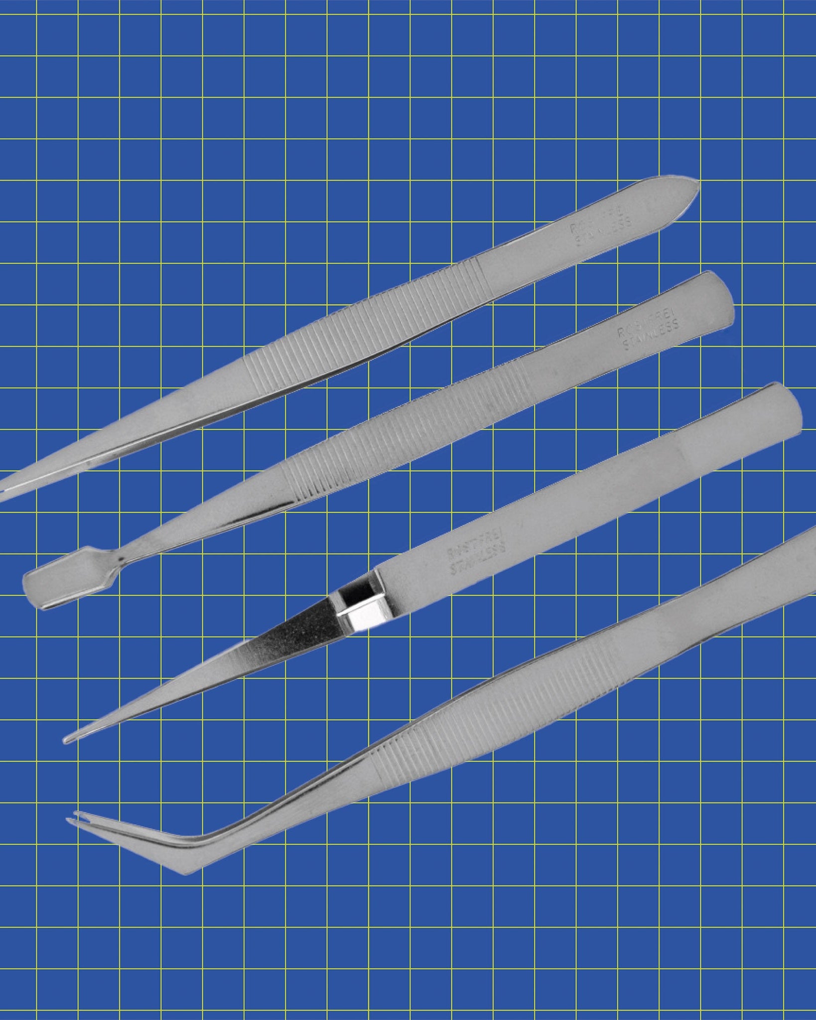 Tufting tweezer set on blue grid background