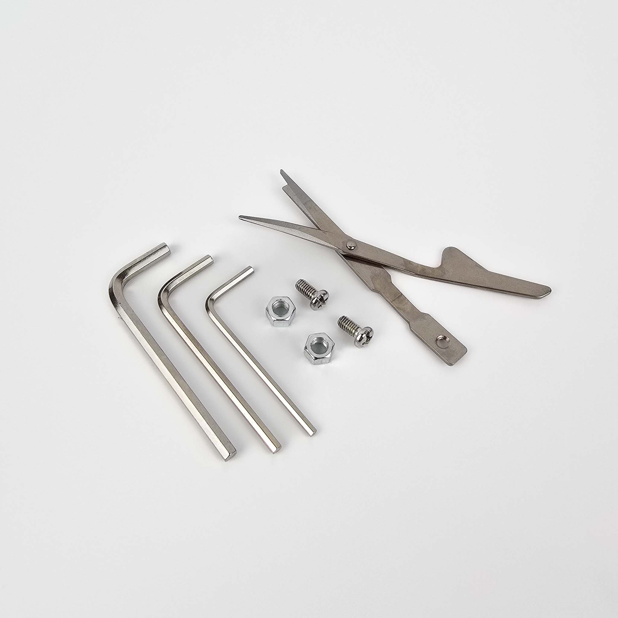AK-5 Spare And Replacement Parts And Tools. Nuts And Screws, Alan Keys, And Replacement Scissors On A White Background