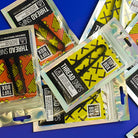 Black Thread Cutters multiple packs scattered across blue backdrop