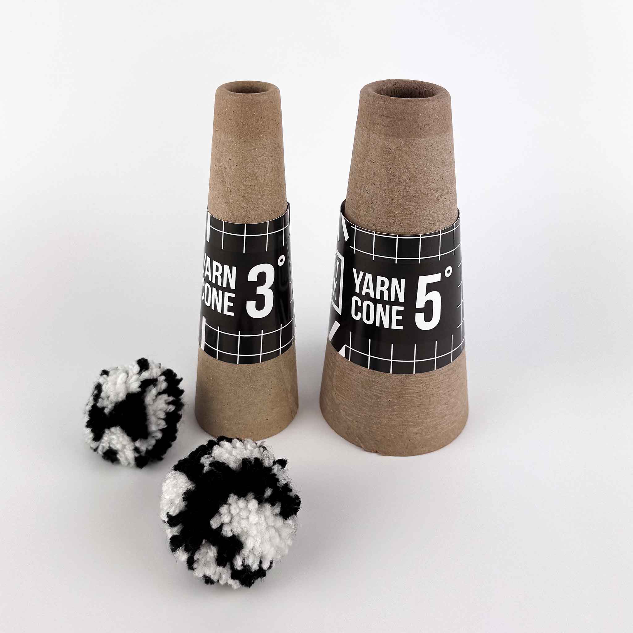 Cardboard yarn winding cones with pompoms