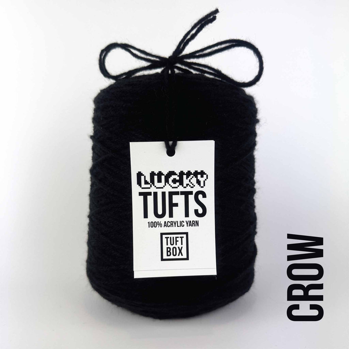 A cone of Lucky Tufts™ acrylic tufting and punch needle yarn in the colour Crow a deep classic black