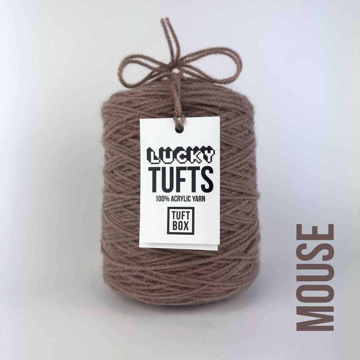 A cone of Lucky Tufts™ acrylic tufting and punch needle yarn in the colour Mouse a soft muted ashen brown