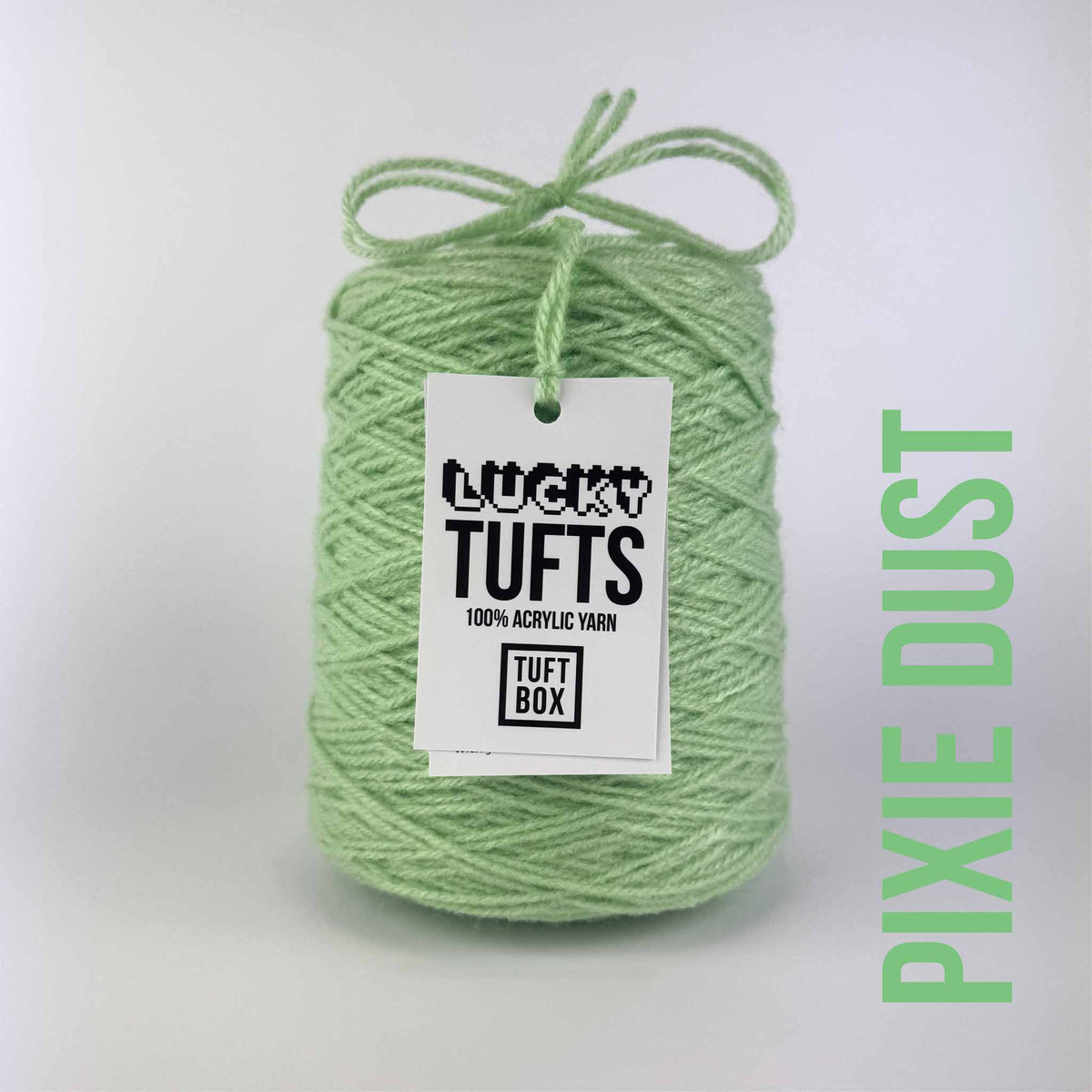 A cone of Lucky Tufts™ acrylic tufting and punch needle yarn in the colour Pixie Dust. A light pale green.