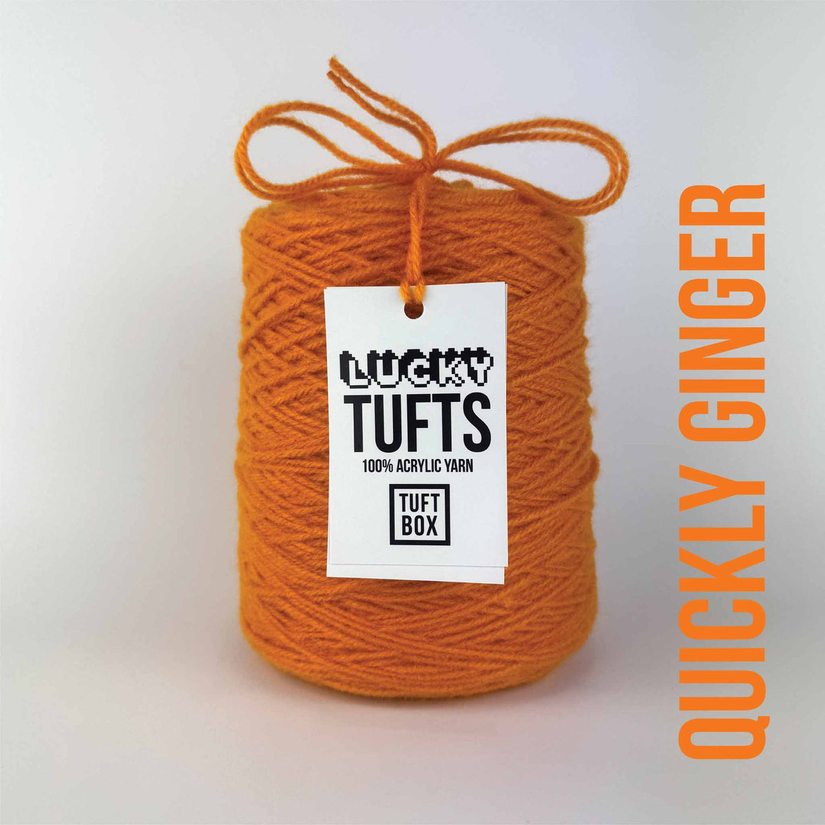 A cone of Lucky Tufts™ acrylic tufting and punch needle yarn in the colour Quickly Ginger a punchy mid-tone orange