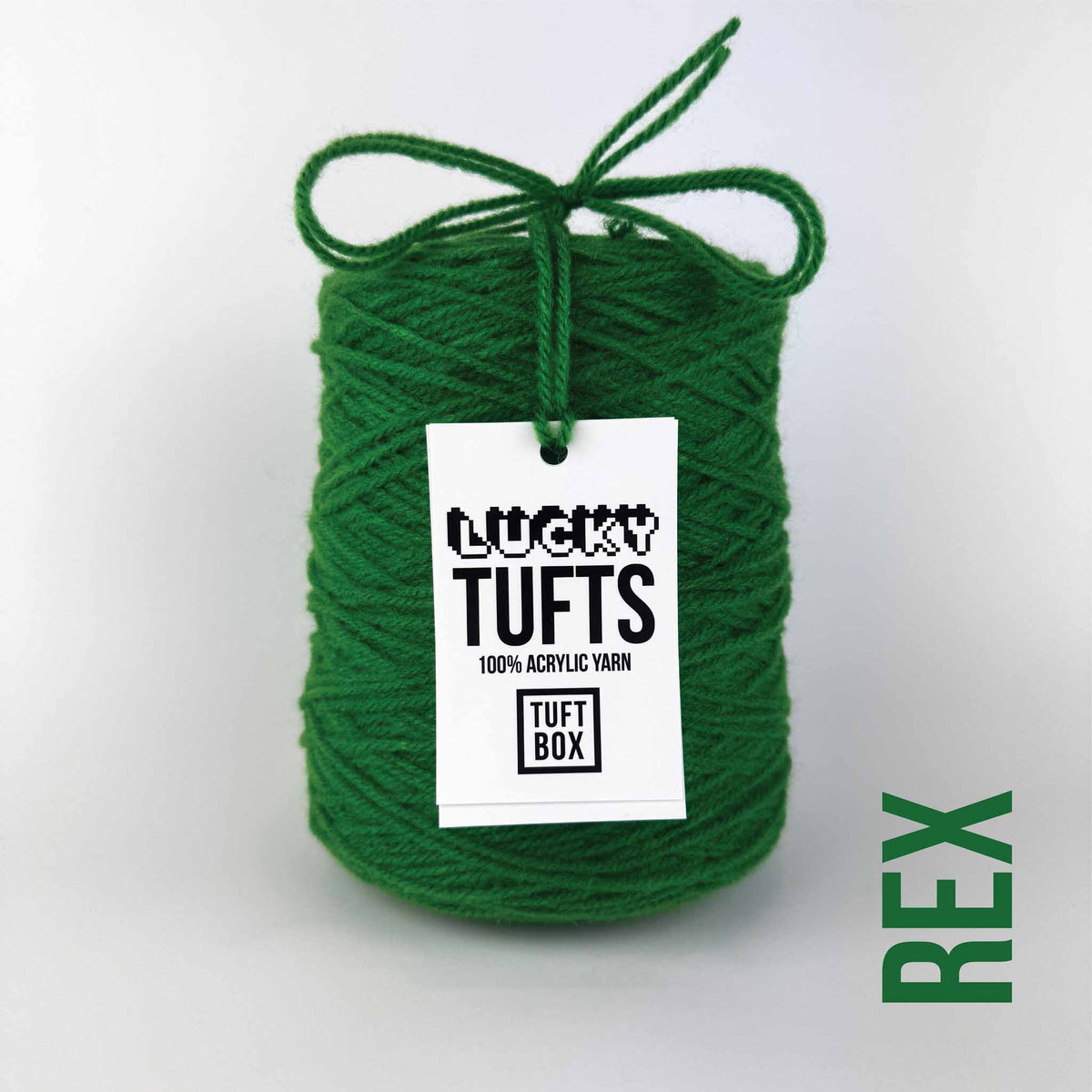 A cone of Lucky Tufts™ acrylic tufting and punch needle yarn in the colour Rex. A full bodied, heavy green.
