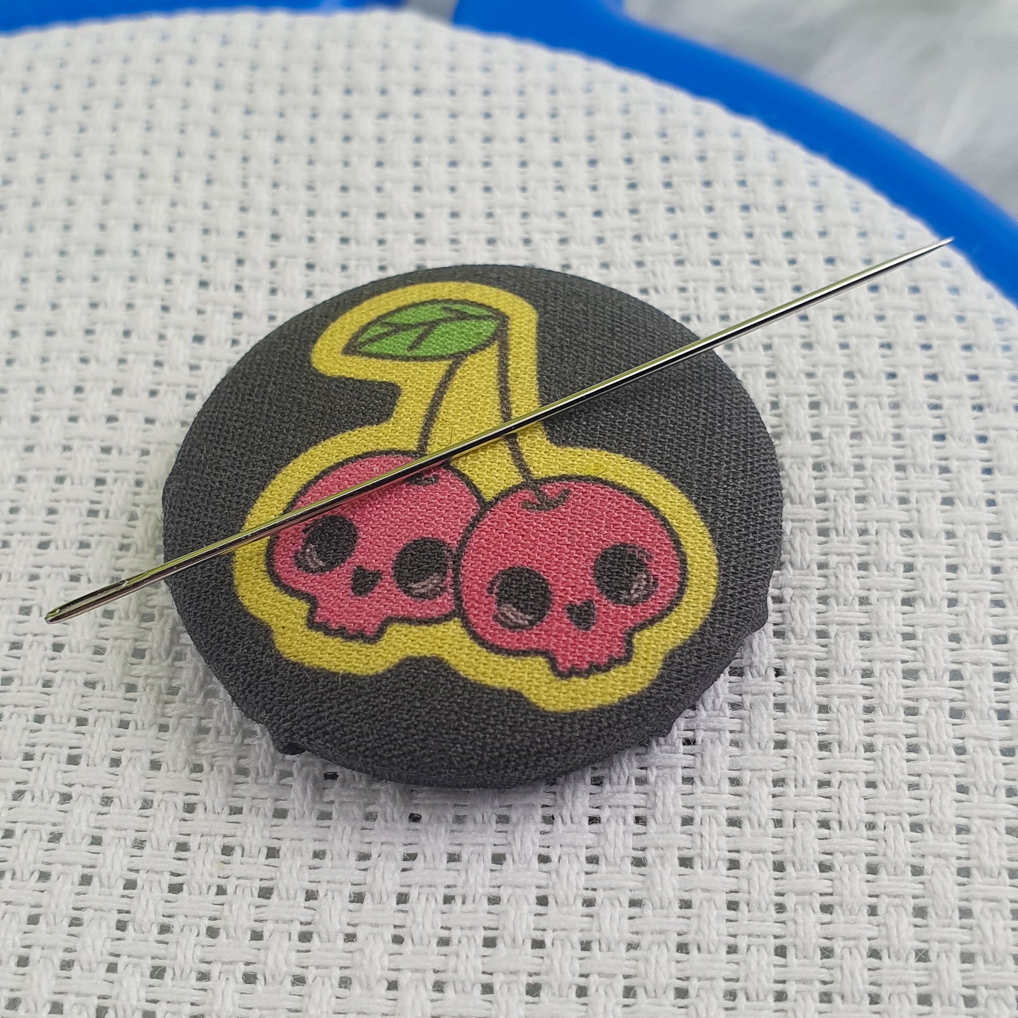 Needle Minder cherry skulls minder close up