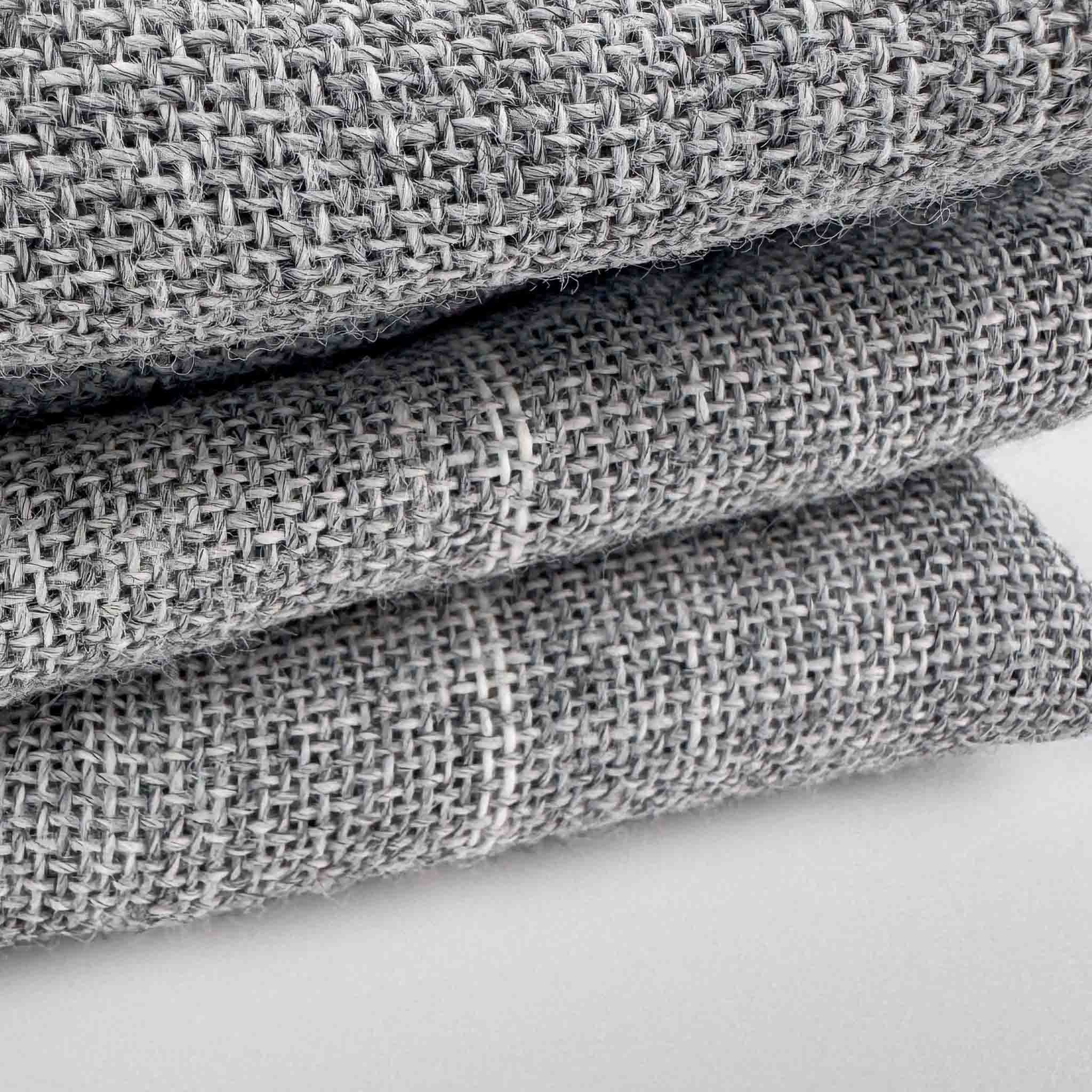Stack of Grey Primary Rug Tufting Fabric fabric swatches on a white background