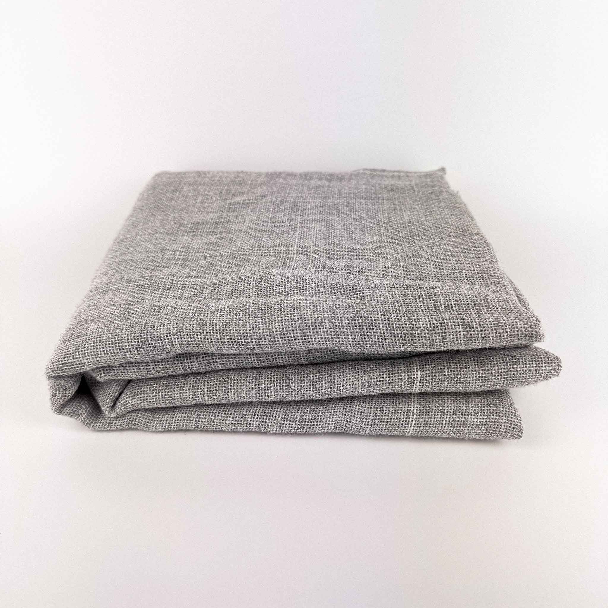 Grey Primary Rug Tufting Fabric swatches folded on a white background