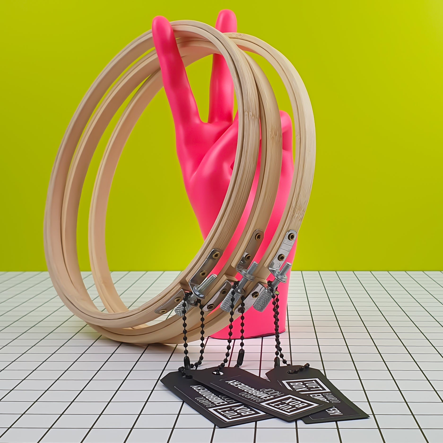 TBX Bamboo Hoops Leaning On Neon Pink Peace Hand
