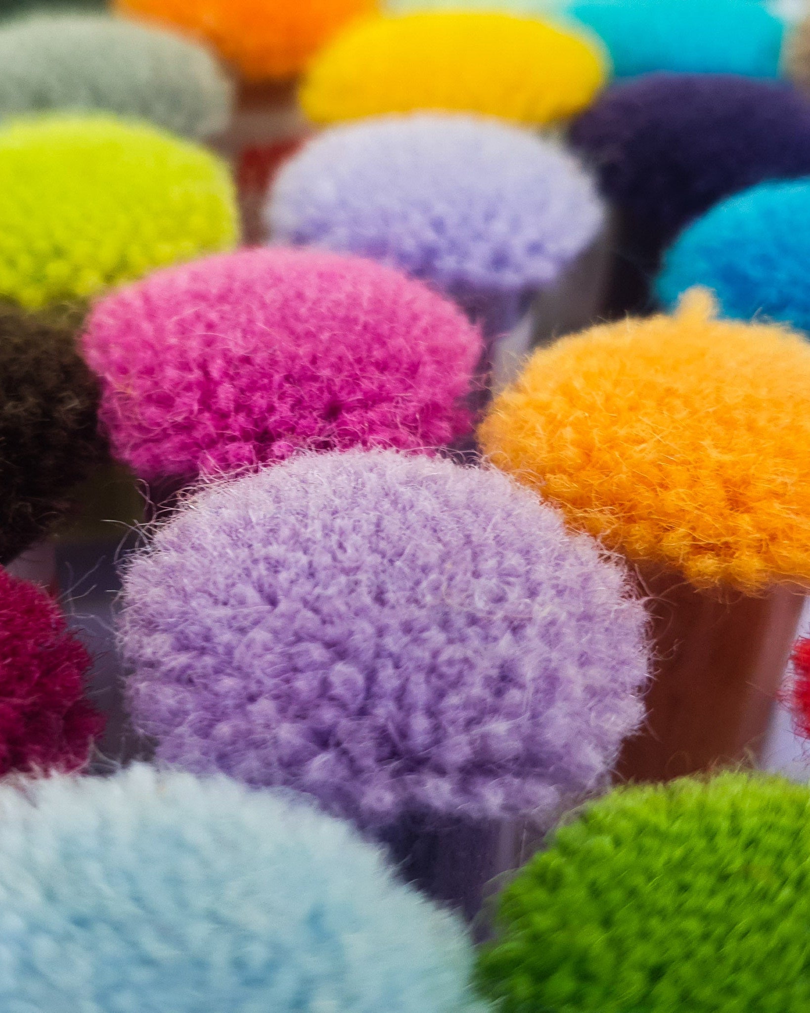 colourful pom pom swatches of rug wool