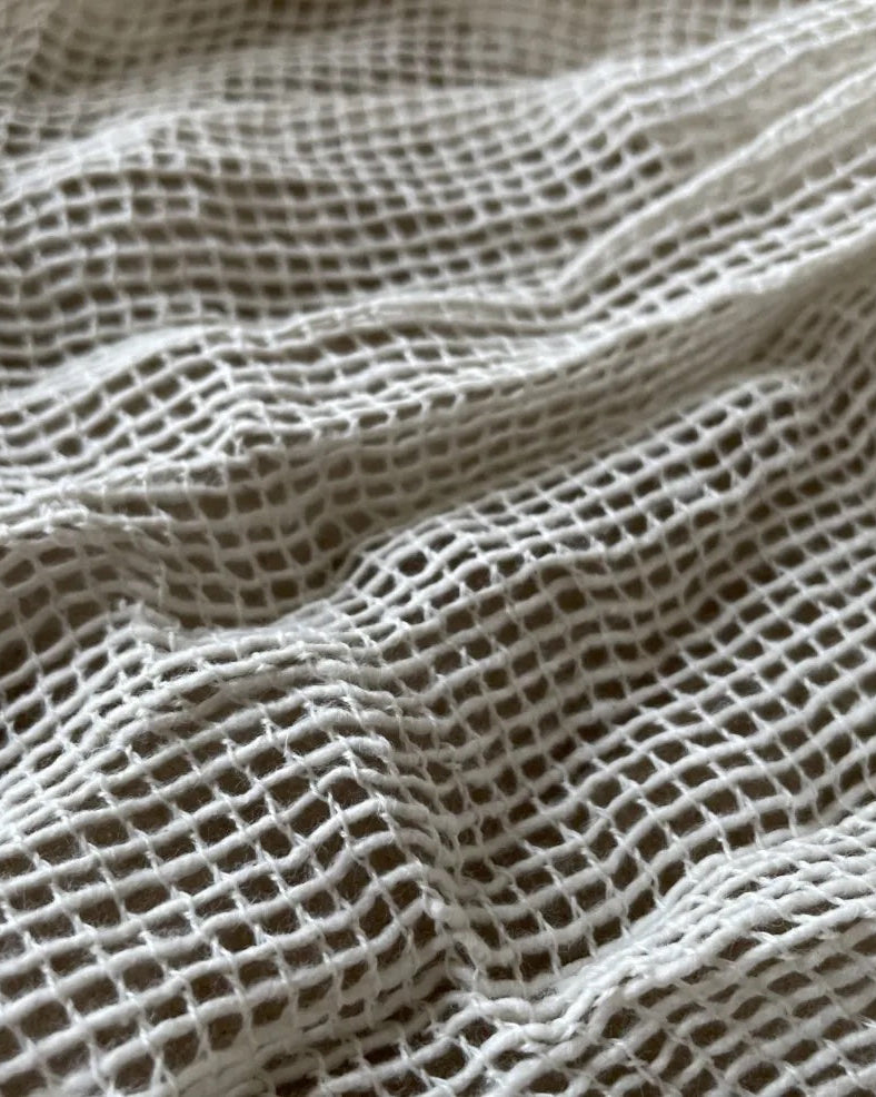 Close up of cotton mesh secondary rug backing fabric