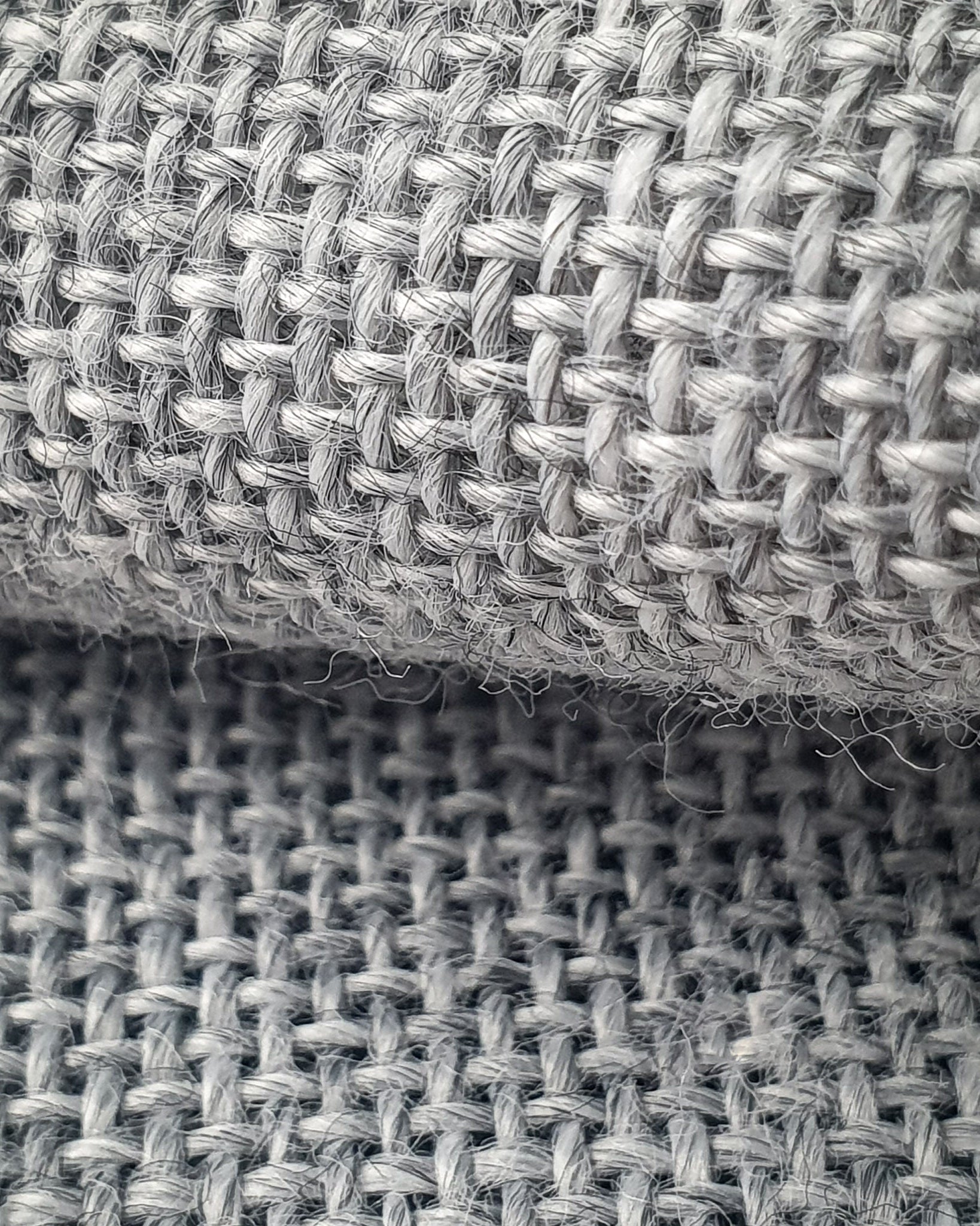Close up of grey primary tufting fabric