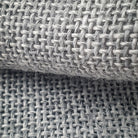 Close up of the weave of primary tufting fabric grey polyester