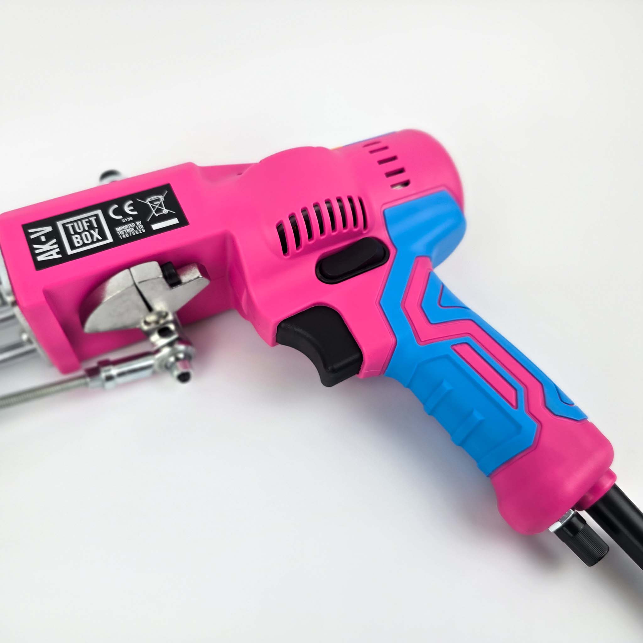 Close Up Of AK-V Tufting Gun Handle. Tuftbox Custom Colours With Fire Pink on Display. Shown On A White Background