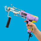 AK-V Rug Tufting Machine Purple Gun Held on Blue Background AK5