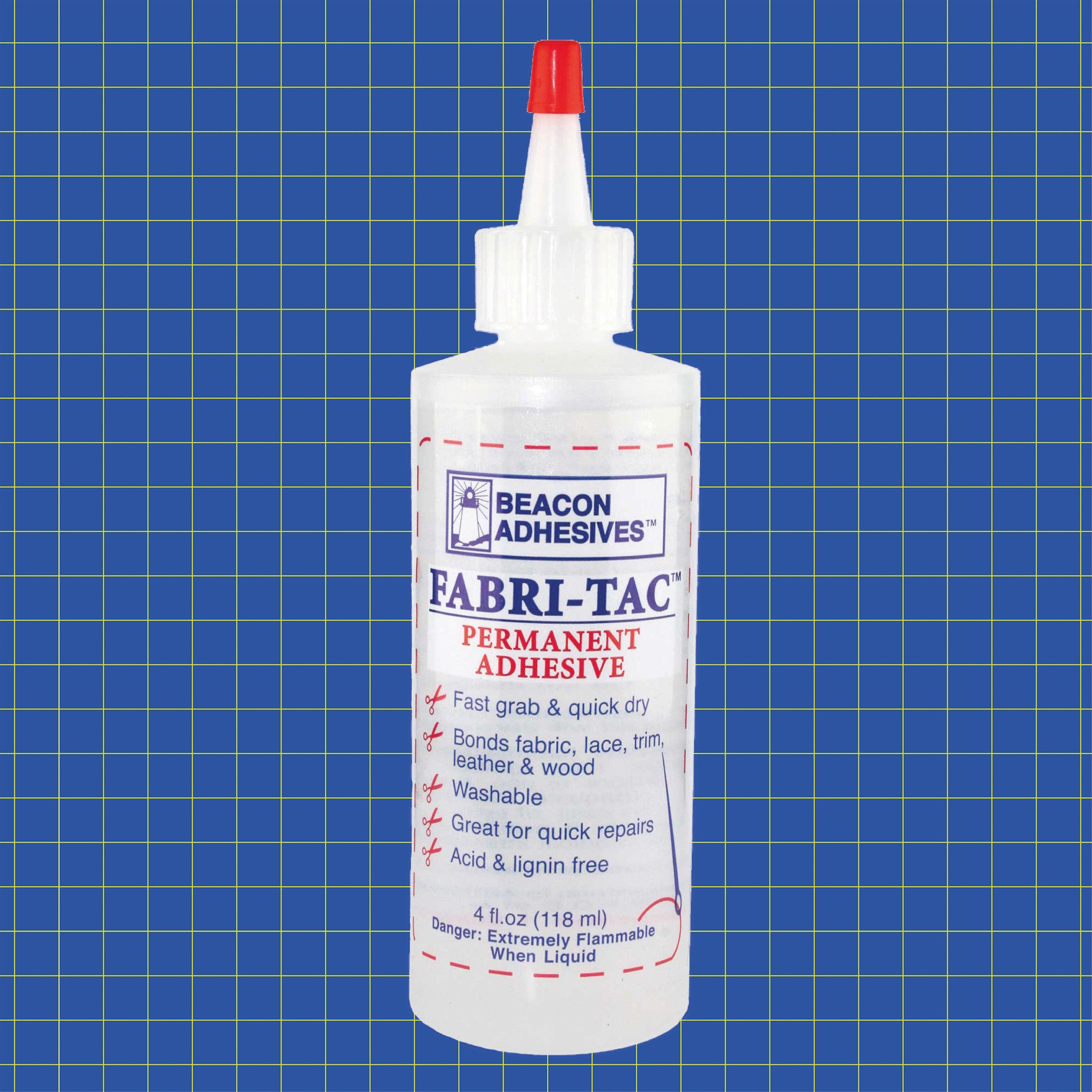 Beacon Fabri-Tac fabric glue bottle on blue grid background