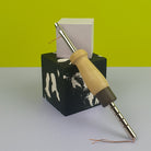 Lavor Adjustable Punch Needle leaning on little concrete cubes
