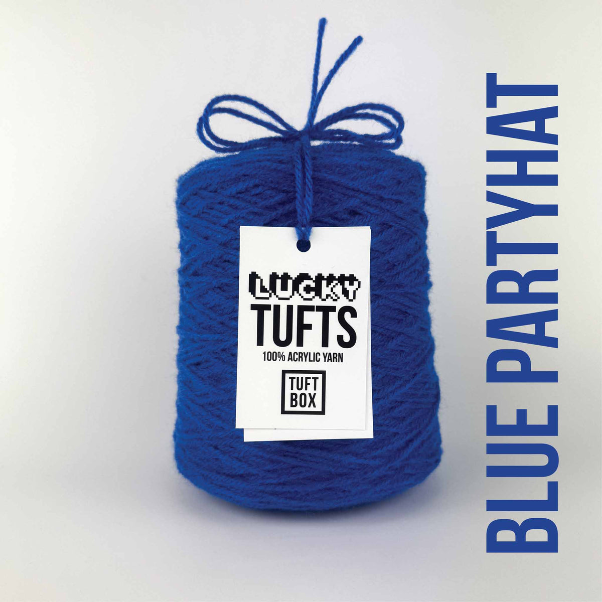 A cone of Lucky Tufts™ acrylic tufting and punch needle yarn in the colour Blue Partyhat. A soft and bright blue.