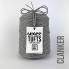 A cone of Lucky Tufts™ acrylic tufting and punch needle yarn in the colour Clanker a  grey