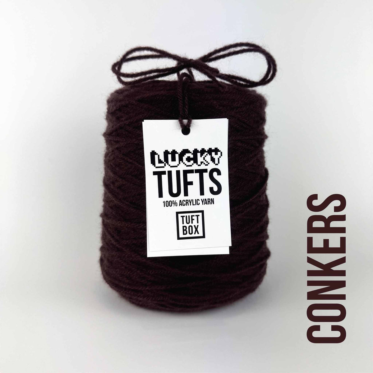 A cone of Lucky Tufts™ acrylic tufting and punch needle yarn in the colour Conkers a deep red-toned brown