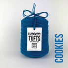A cone of Lucky Tufts™ acrylic tufting and punch needle yarn in the colour Cookies. A playful and energetic blue.