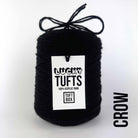A cone of Lucky Tufts™ acrylic tufting and punch needle yarn in the colour Crow a deep classic black 