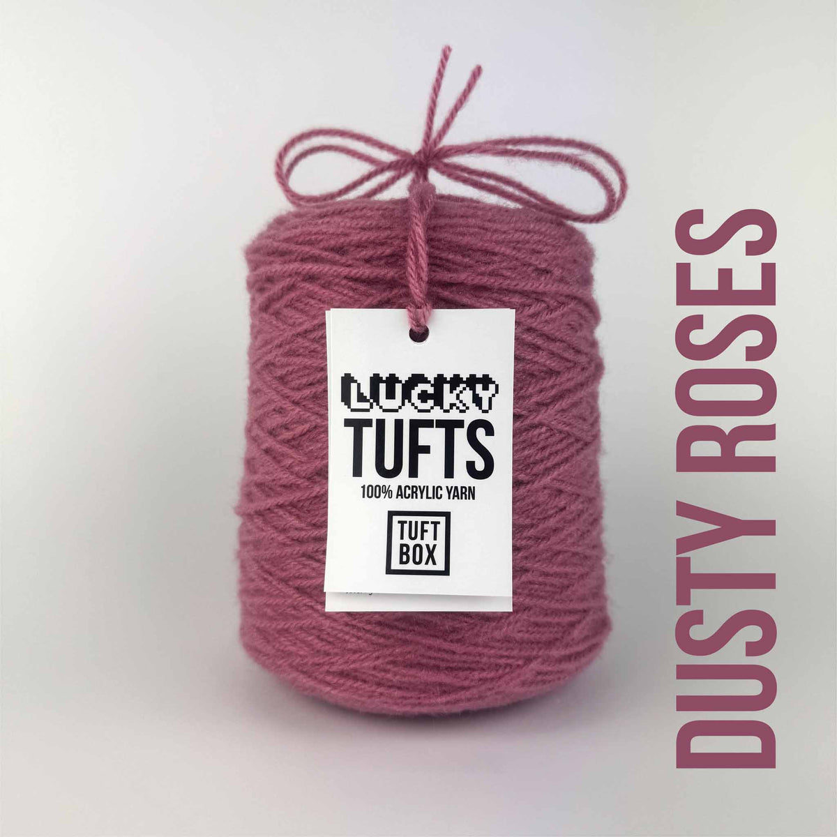 A cone of Lucky Tufts™ acrylic tufting and punch needle yarn in the colour Dusty Rose. A dark warm pink.