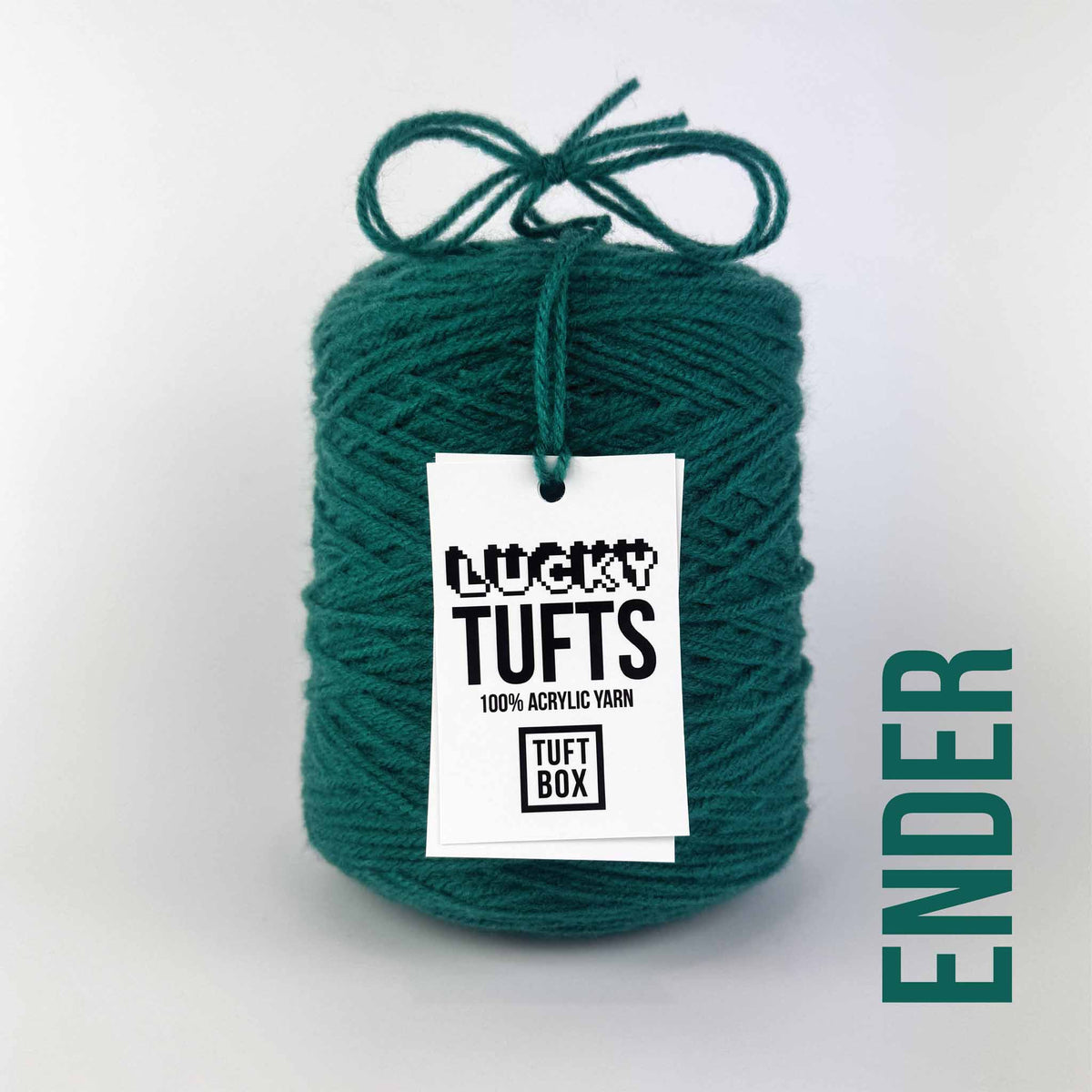 A cone of Lucky Tufts™ acrylic tufting and punch needle yarn in the colour Ender. A greenish blue teal.