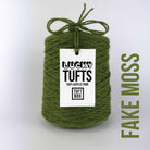 A cone of Lucky Tufts™ acrylic tufting and punch needle yarn in the colour Fake Moss. A warm green with a yellow hue. 