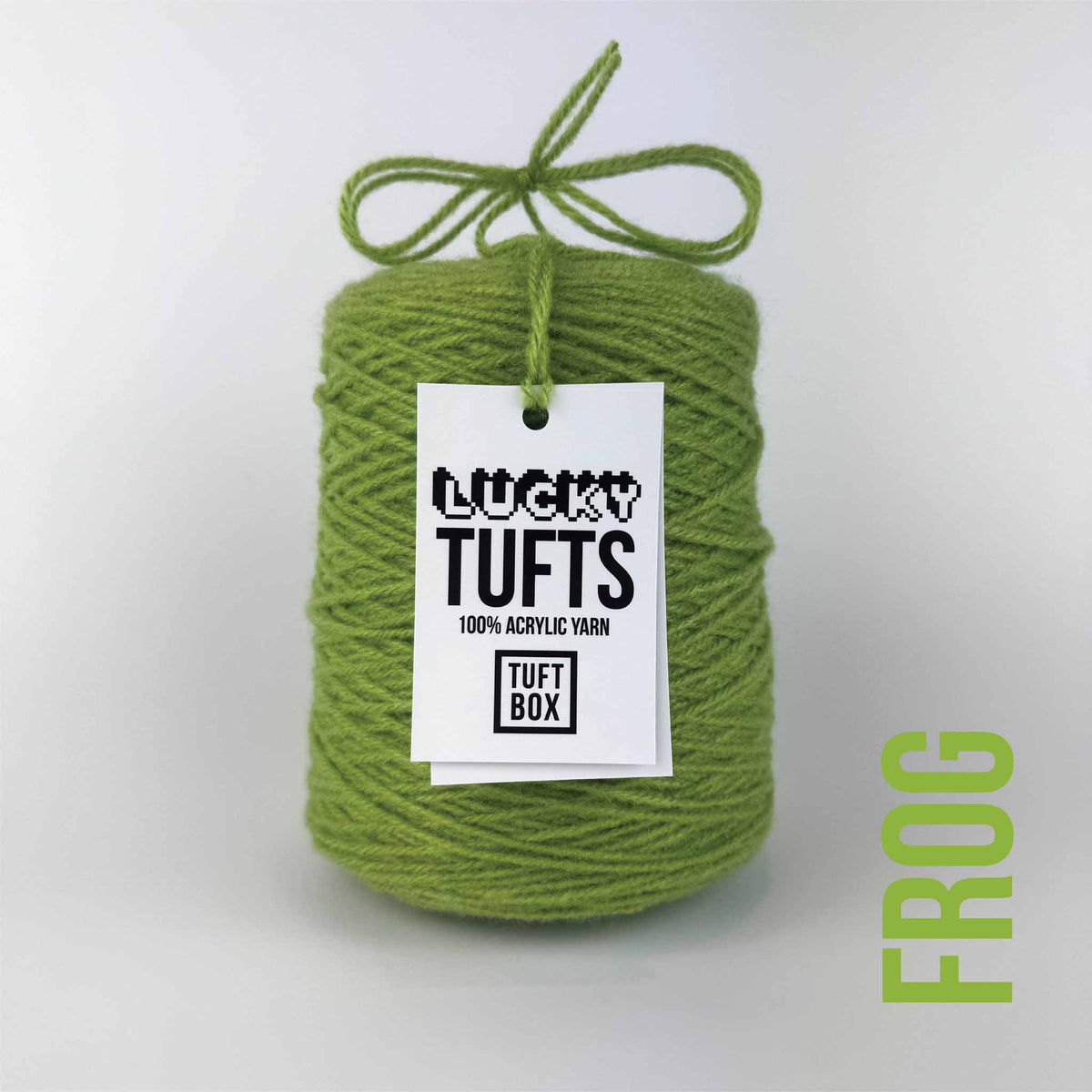A cone of Lucky Tufts™ acrylic tufting and punch needle yarn in the colour Frog. A solid green. 