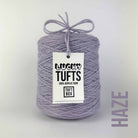A cone of Lucky Tufts™ acrylic tufting and punch needle yarn in the colour Haze. A light purple with blue tones.