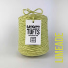 A cone of Lucky Tufts™ acrylic tufting and punch needle yarn in the colour Limeade. A bright pale green with strong yellow midtones.
