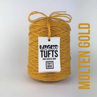 A cone of Lucky Tufts™ acrylic tufting and punch needle yarn in the colour Molten Gold a rich golden yellow