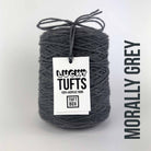 A cone of Lucky Tufts™ acrylic tufting and punch needle yarn in the colour Morally Grey a classic midtone grey 