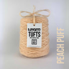 A cone of Lucky Tufts™ acrylic tufting and punch needle yarn in the colour Peach Puff a vibrant light pastel peach 