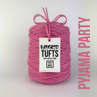 A cone of Lucky Tufts™ acrylic tufting and punch needle yarn in the colour Pyjama Party. A soft, pastel pink