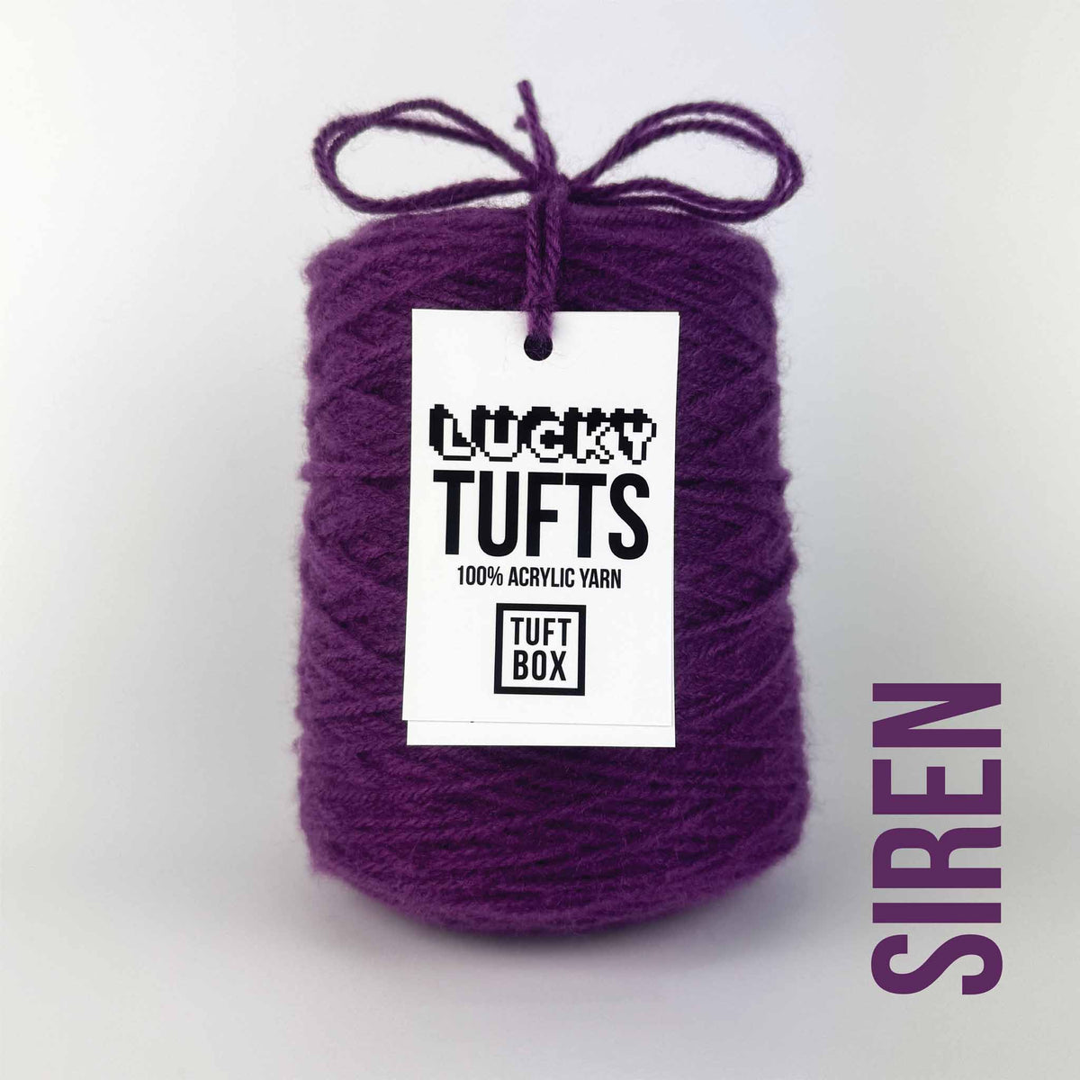 A cone of Lucky Tufts™ acrylic tufting and punch needle yarn in the colour siren. A dark and saturated purple.
