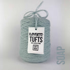 A cone of Lucky Tufts™ acrylic tufting and punch needle yarn in the colour Soap. A grey, light mint green.