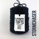 A cone of Lucky Tufts™ acrylic tufting and punch needle yarn in the colour Stormchaser a deep petrol blue black 