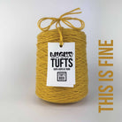 A cone of Lucky Tufts™ acrylic tufting and punch needle yarn in the colour This is Fine a dark muted yellow 