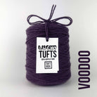 A cone of Lucky Tufts™ acrylic tufting and punch needle yarn in the colour Voodoo. A muddy purple.