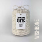 A cone of Lucky Tufts™ acrylic tufting and punch needle yarn in the colour Wishbone a cool toned off-white