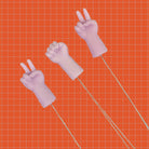 Needle Threaders Hands Purple on grid 2