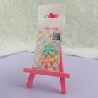 Flower Needle Threaders Peach/Mint in pastel grid packaging