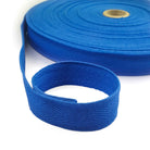 Blue webbing twill tape roll on a white background